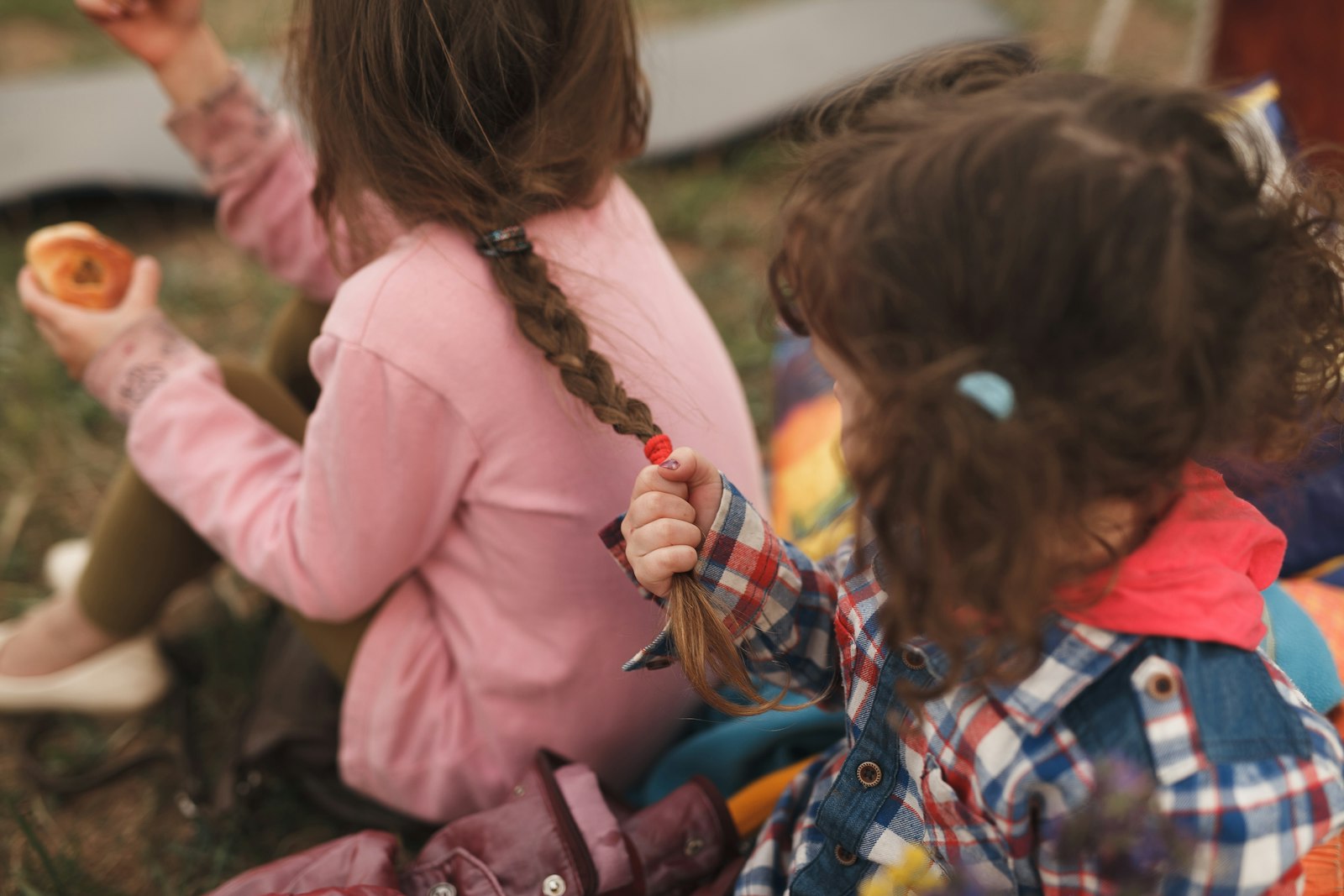 Two children playing together outside