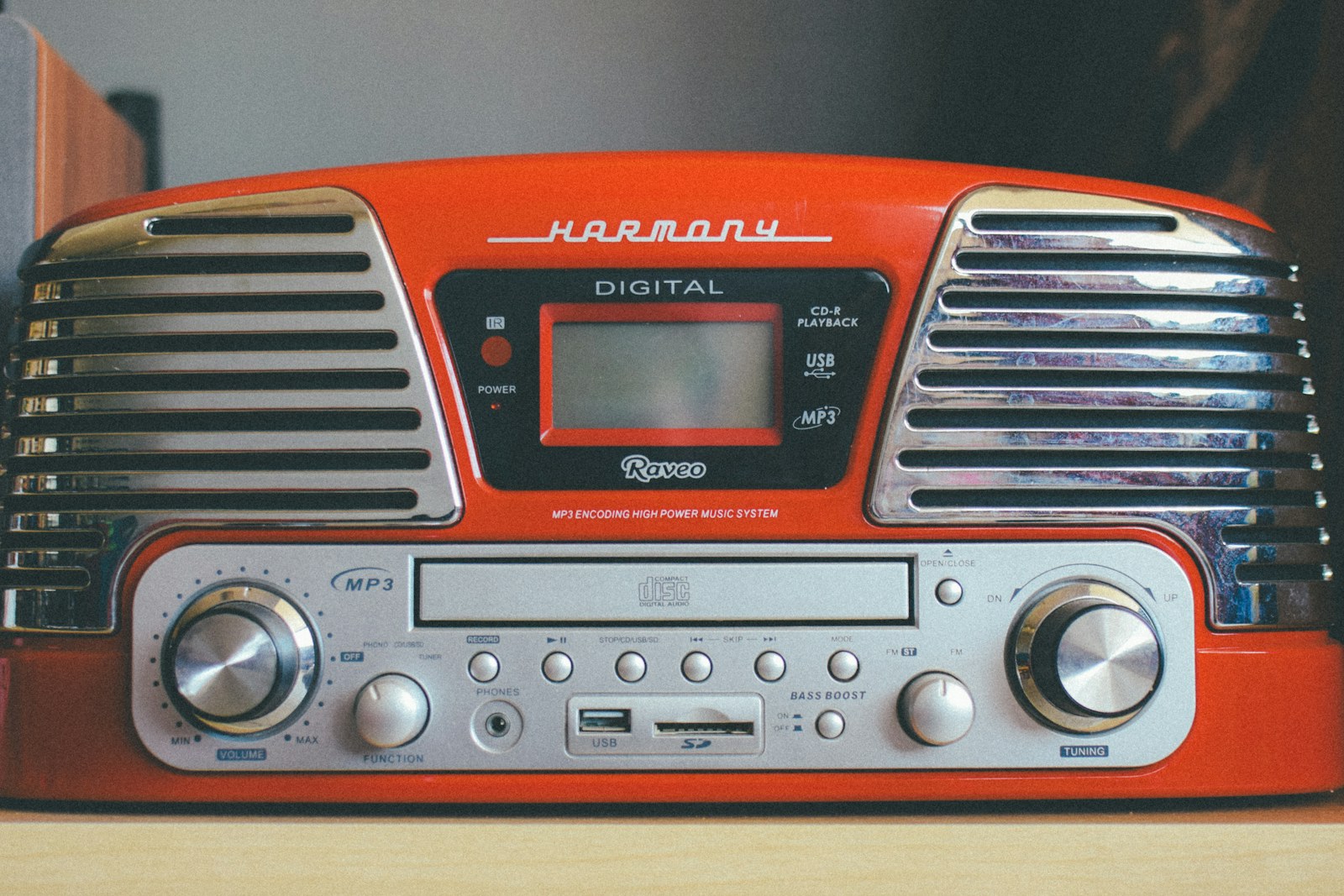 A retro CD player on a shelf, the child-operated side of CDs vs streaming for kids