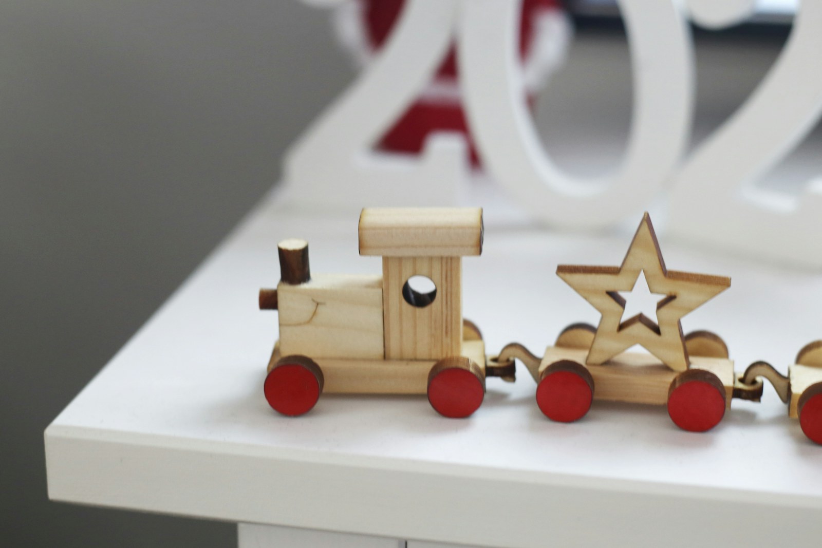 A wooden toy train, one of the screen-free Christmas gifts for toddlers that still gets played with past January